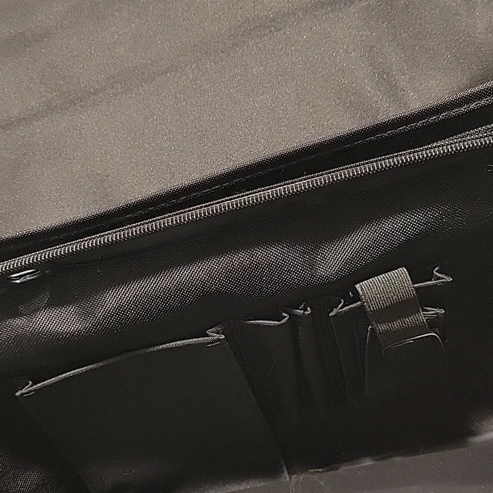 Solo black briefcase with a pullout sleeve for your laptop in black.